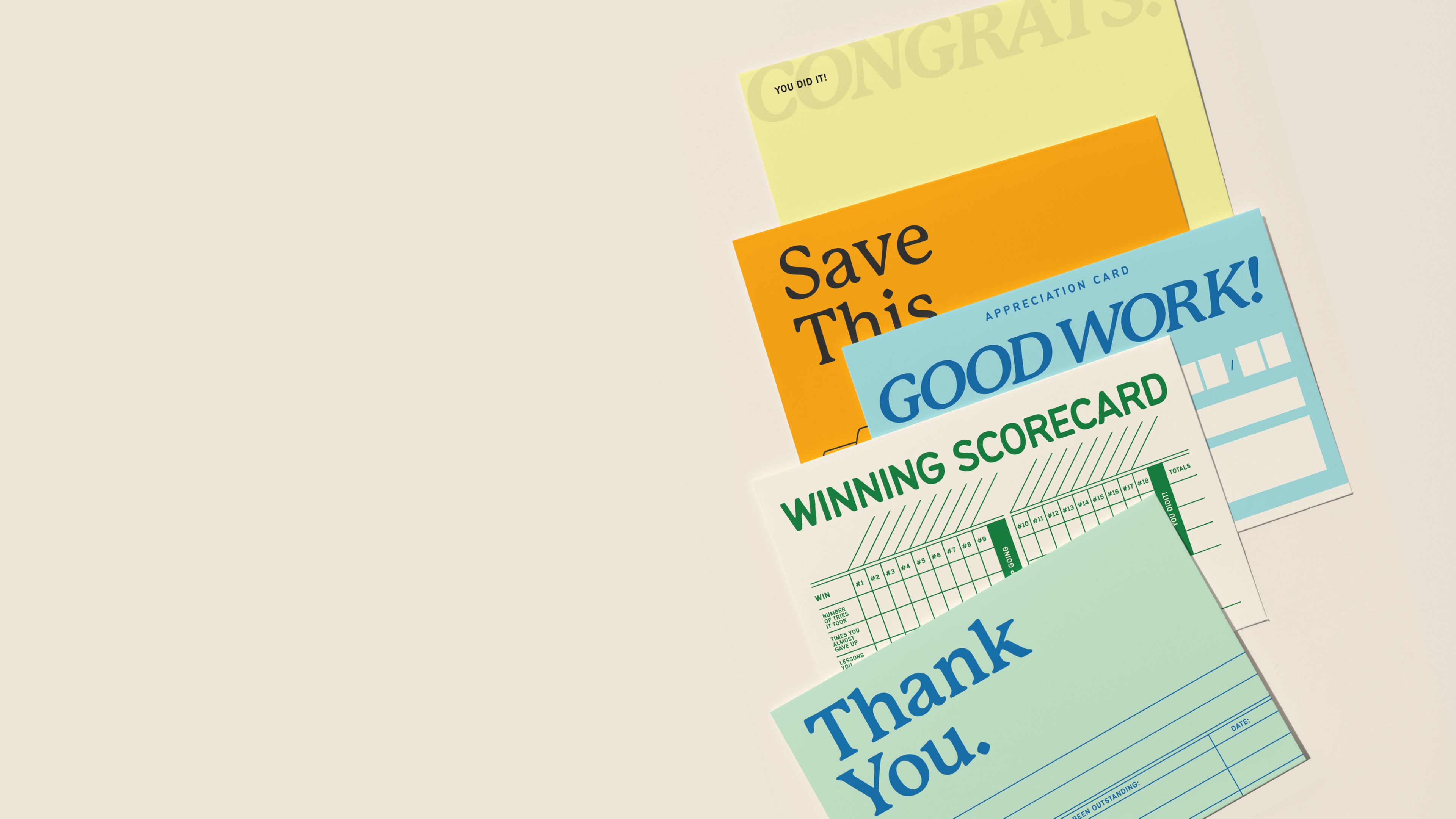 Collection of motivational and congratulatory cards on a beige background